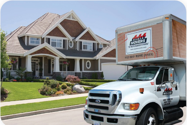 AAA Movers truck parked outside a large home