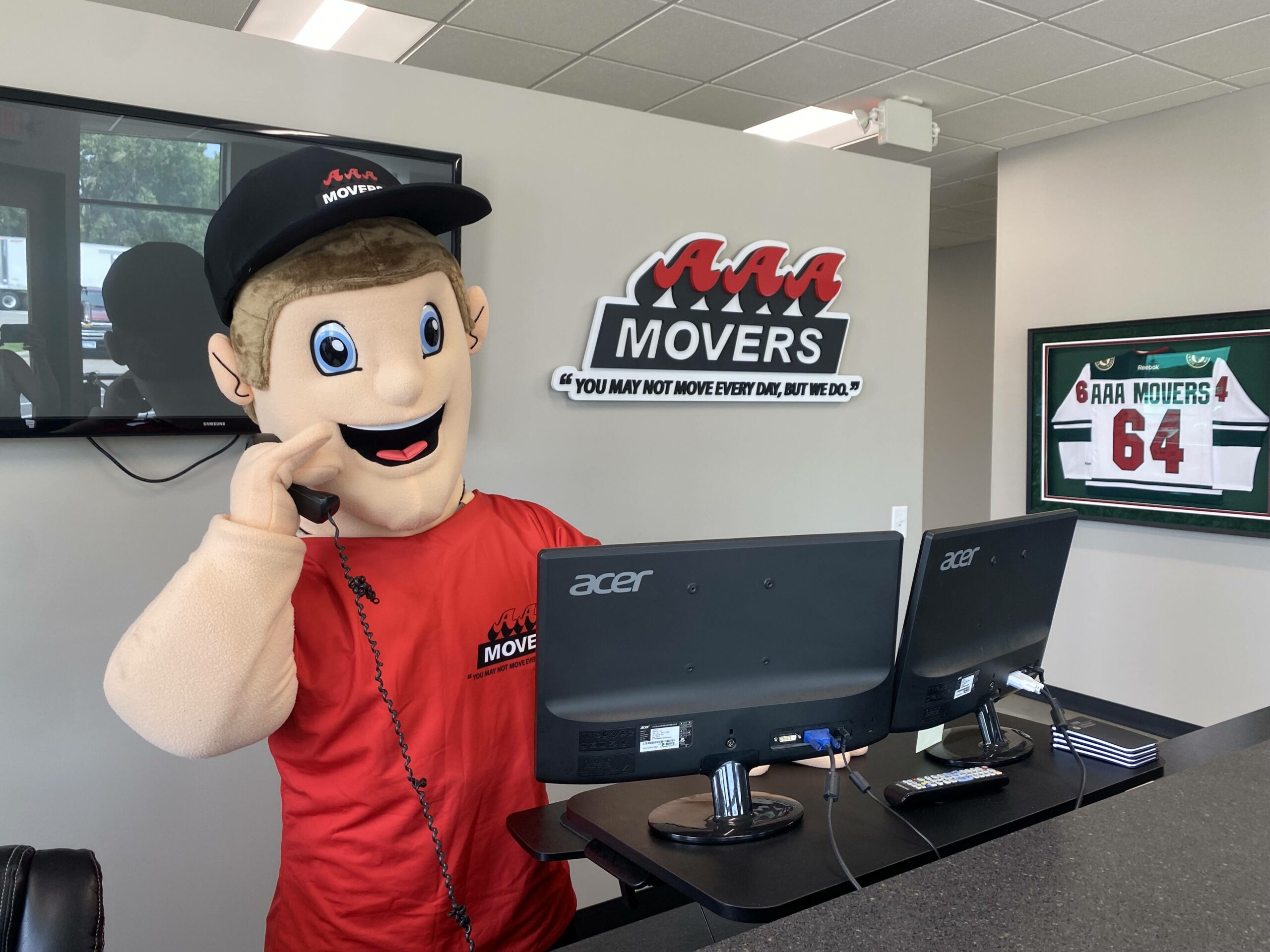 Marty, our mascot, answering the phone in the AAA Movers office