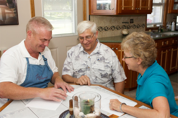 Three seniors sitting around a table