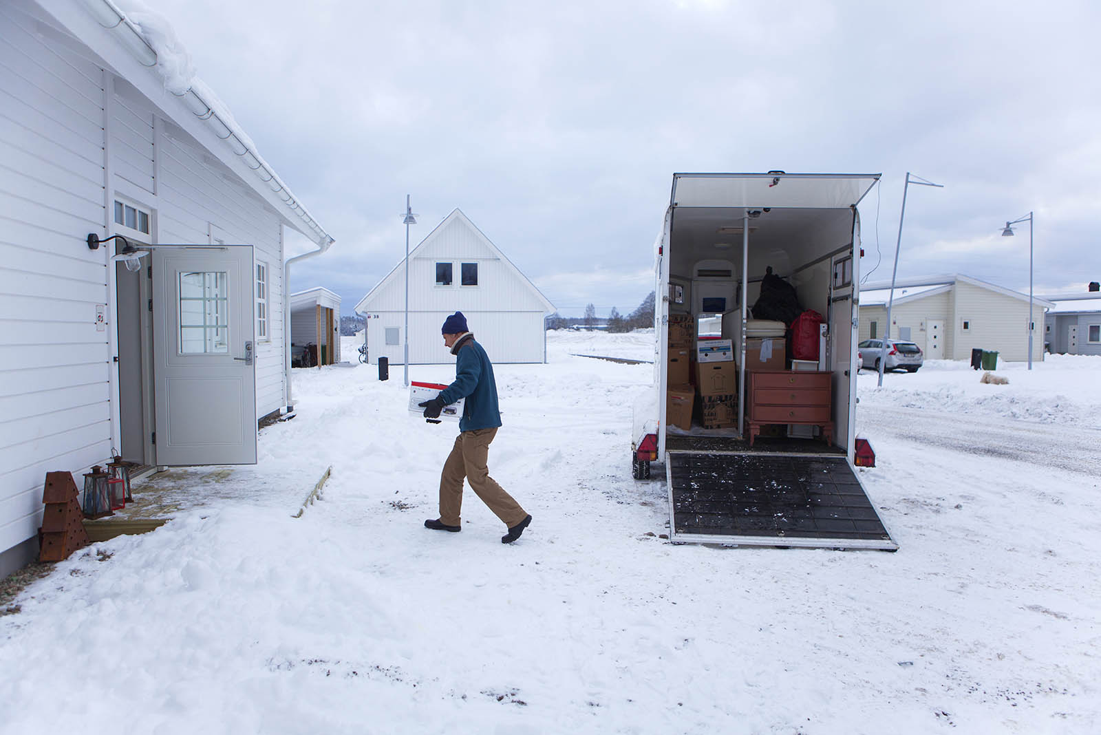 AAA movers loading a truck during a winter move in a Minneapolis neighborhood