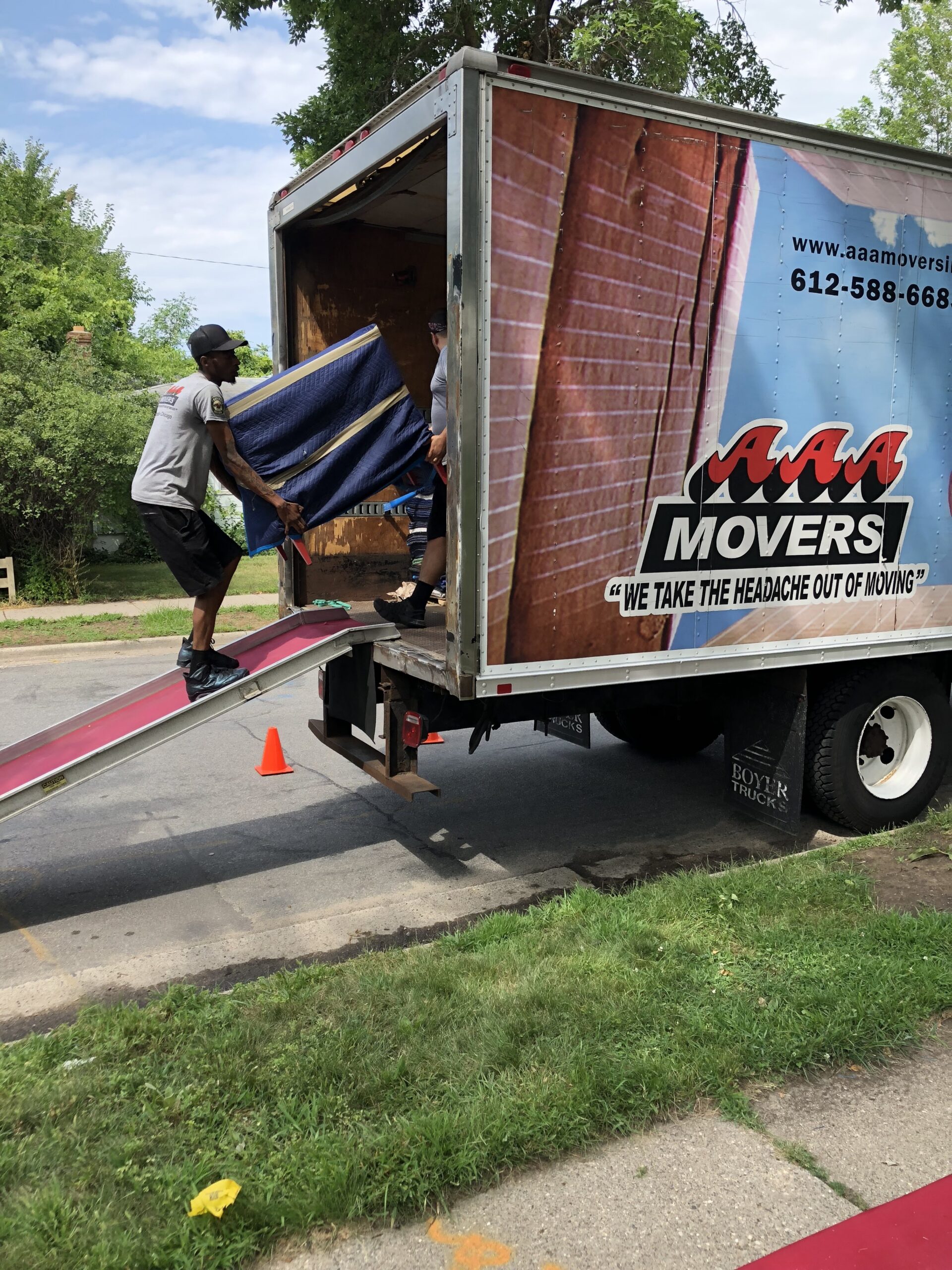 Melrose Park movers carrying boxes from a home