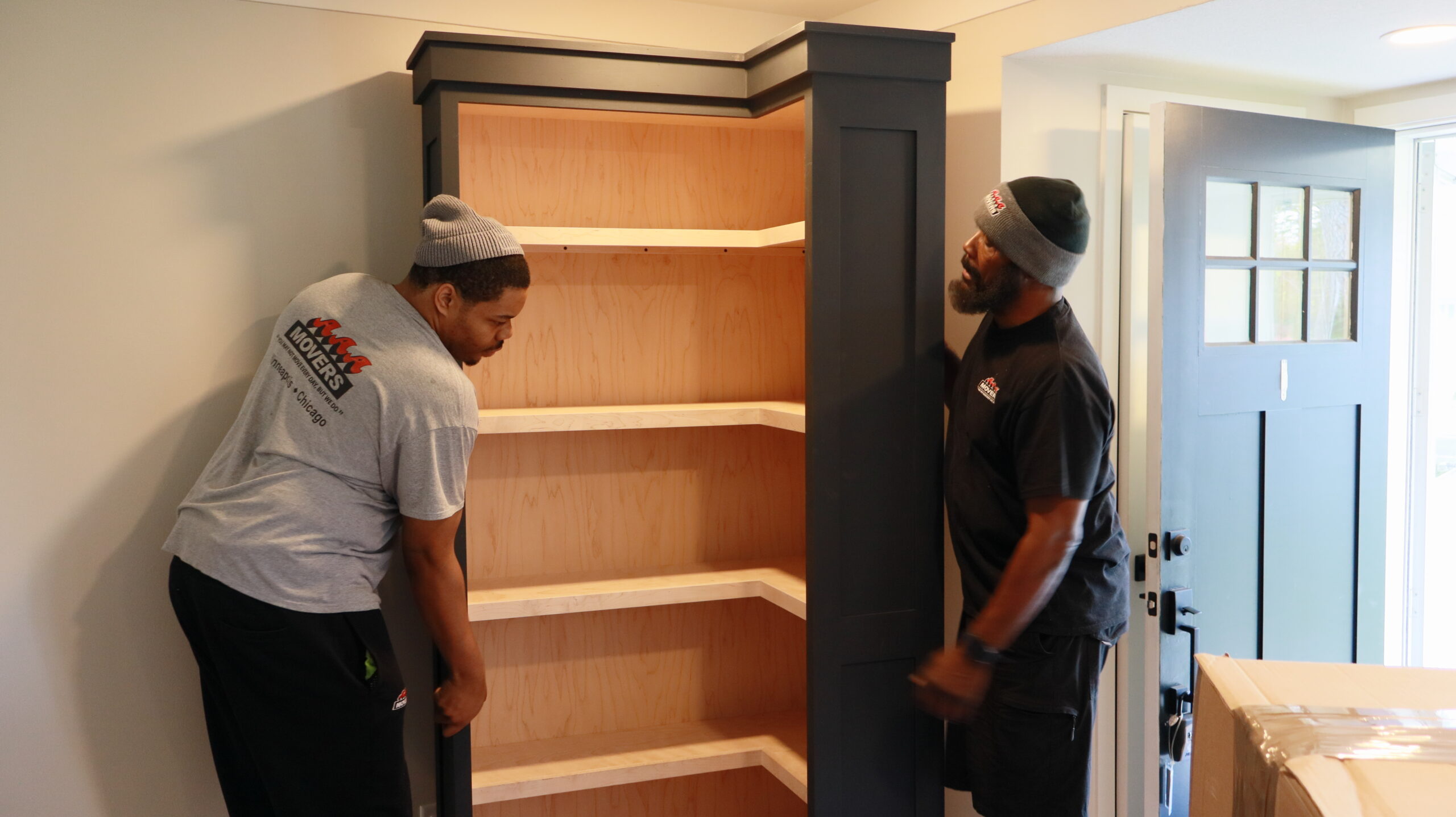 Melrose Park movers carrying boxes from a home